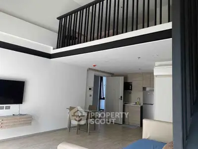 Modern loft apartment with open kitchen and stylish mezzanine