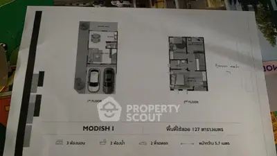 Modern two-story house floor plan with parking and three bedrooms.