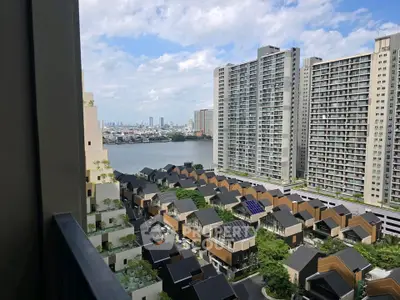 Stunning high-rise view of modern cityscape with river and residential buildings.