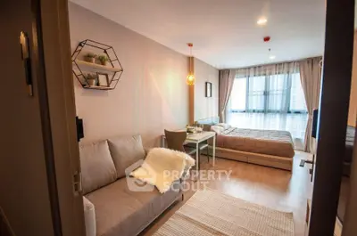 Modern studio apartment with cozy living area and stylish decor