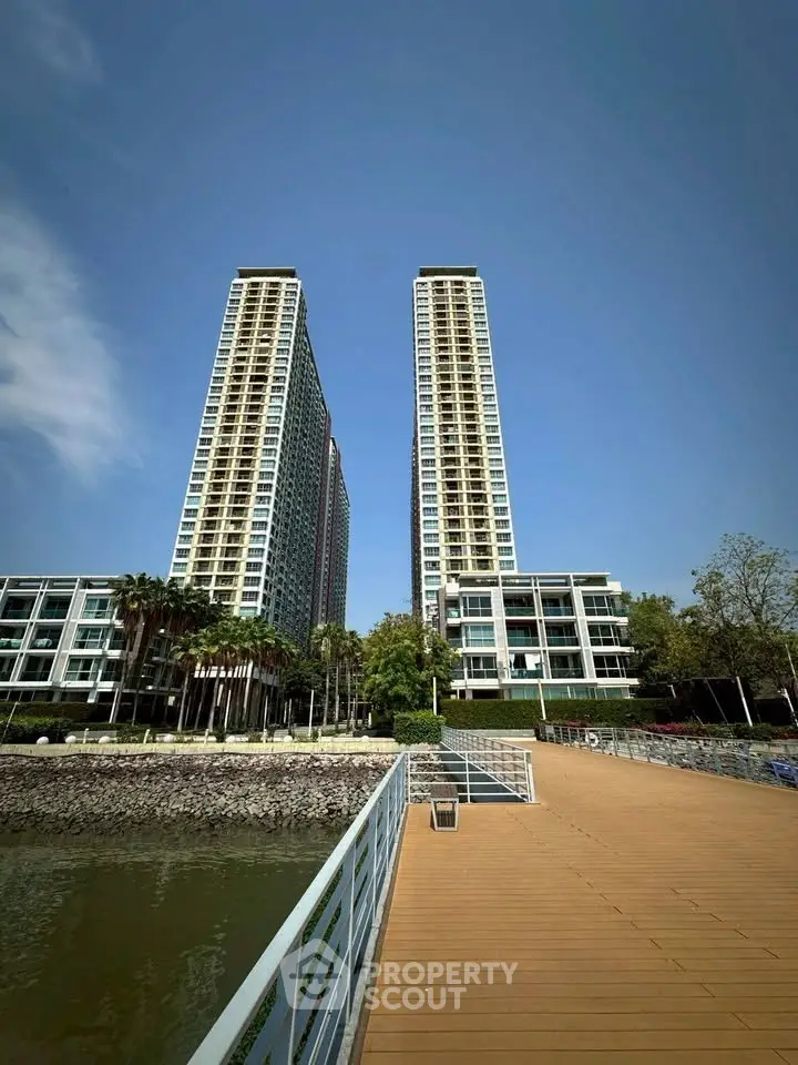Stunning waterfront high-rise buildings with modern architecture and scenic views.