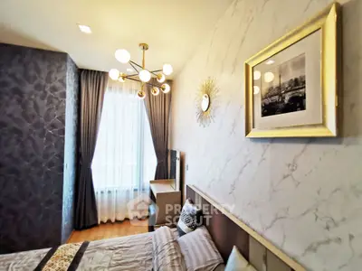 Luxurious bedroom with elegant decor and modern lighting in a stylish apartment.