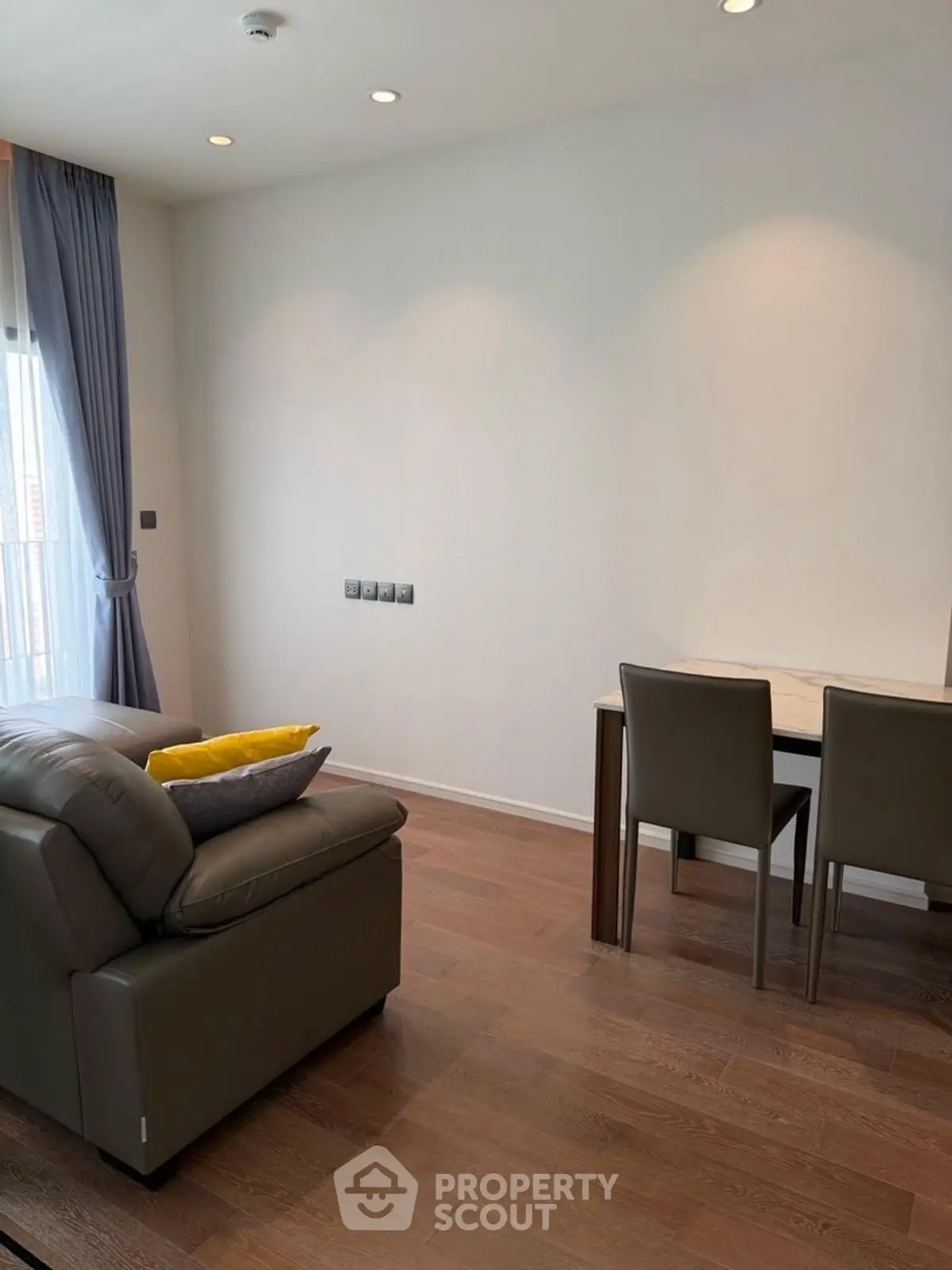 Modern living room with sleek furniture and natural light