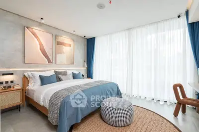 Modern bedroom with stylish decor and large windows for natural light