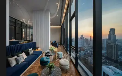 Luxurious high-rise living room with panoramic city views and elegant decor.