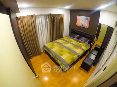 Cozy bedroom with modern decor and wooden flooring