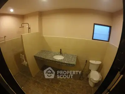 Spacious bathroom with modern fixtures and elegant tile design