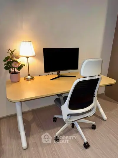 Modern home office setup with ergonomic chair and sleek desk, perfect for productivity and comfort.