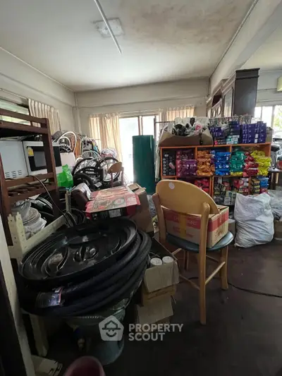 Cluttered storage room filled with various items and supplies, showcasing potential for organization.