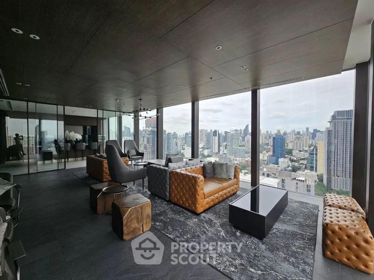 Luxurious high-rise living room with panoramic city views and modern furnishings.