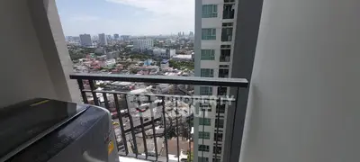 High-rise balcony with stunning cityscape view and washing machine.