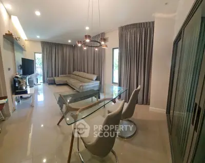Spacious modern living room with elegant furniture and large windows
