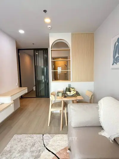 Modern living room with cozy dining area and stylish decor