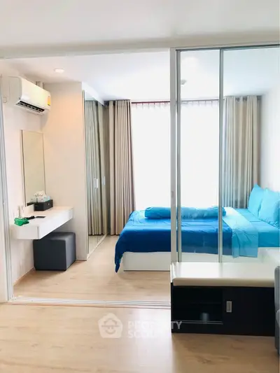 Modern bedroom with glass partition and stylish decor in a bright apartment