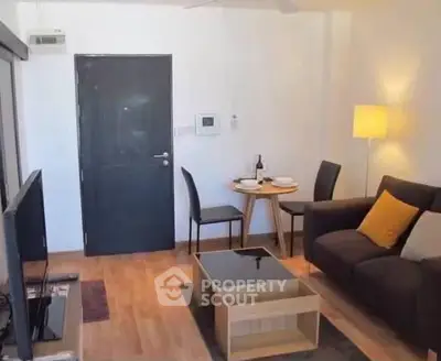 Cozy living room with modern furniture and warm lighting, perfect for relaxation and entertainment.