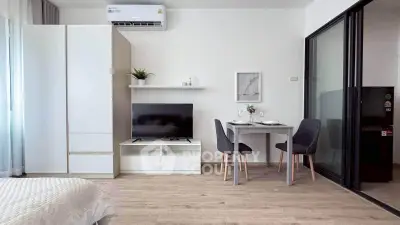 Modern studio apartment with sleek furniture and natural light