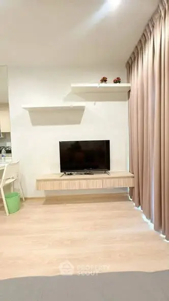 Modern living room with floating TV stand and elegant curtains