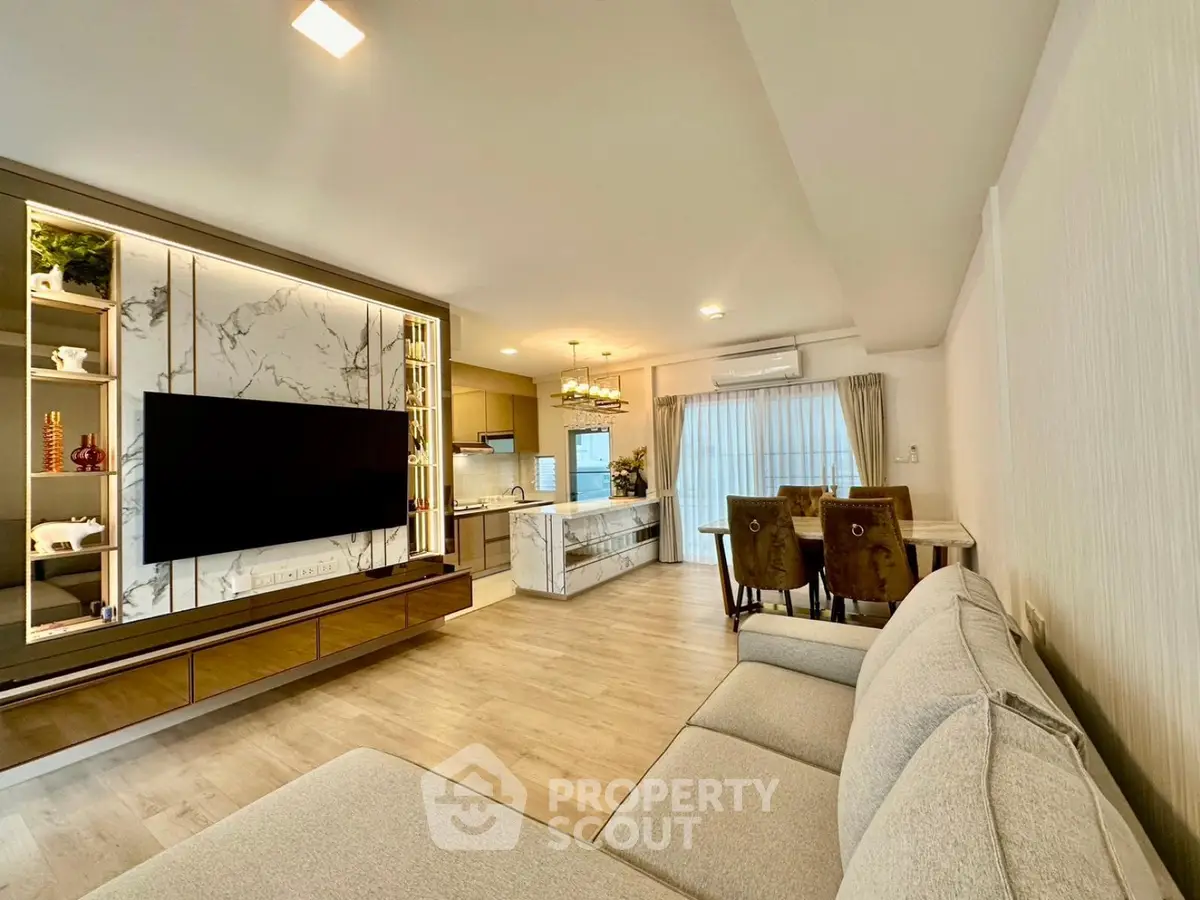 Spacious modern living room with open kitchen and elegant decor