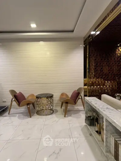 Luxurious modern living room with elegant chairs and marble flooring