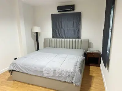 Modern bedroom with stylish bed and minimalist decor