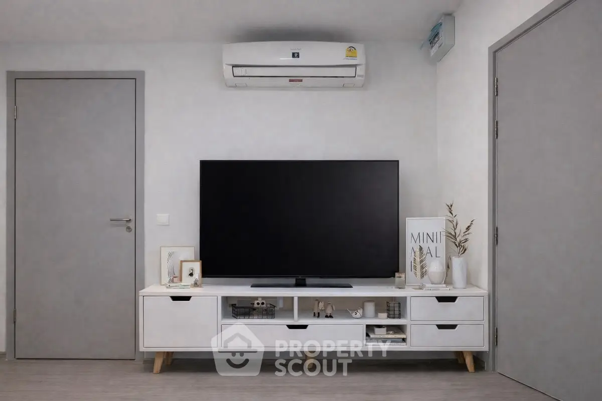 Modern living room with sleek TV unit and minimalist decor