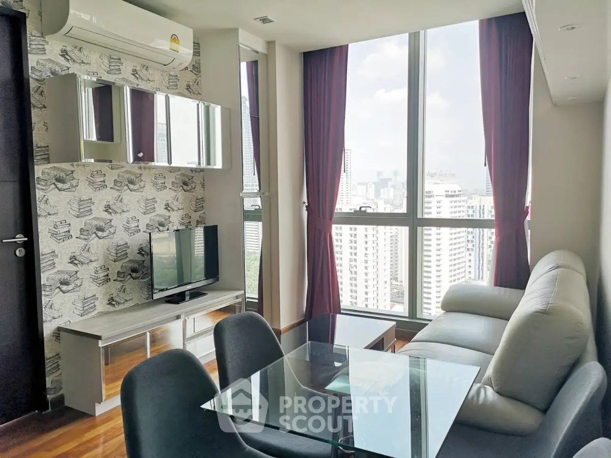 Modern living room with city view, stylish decor, and natural light.