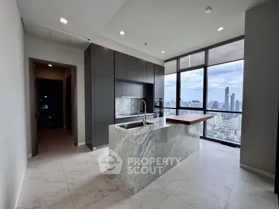 Luxurious modern kitchen with marble island and stunning city view