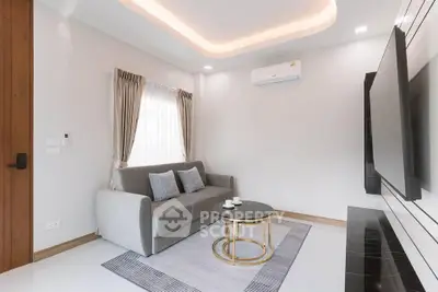 Modern living room with sleek design and cozy seating area