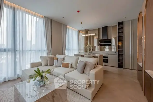 Luxurious modern living room with open kitchen and elegant decor