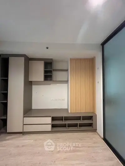 Modern minimalist living room with built-in storage and sleek design