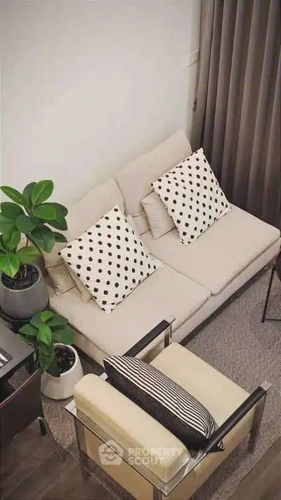 Stylish modern living room with cozy beige sofa and chic decor