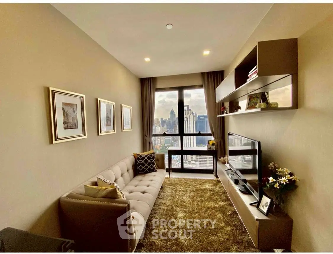 Stylish living room with city view, modern decor, and cozy seating in a high-rise apartment.