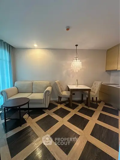 Elegant living room with stylish parquet flooring and cozy seating area in modern apartment.