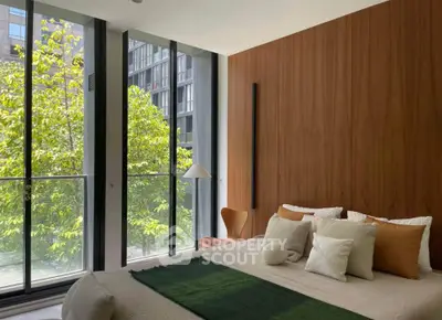 Luxurious bedroom with floor-to-ceiling windows and modern decor