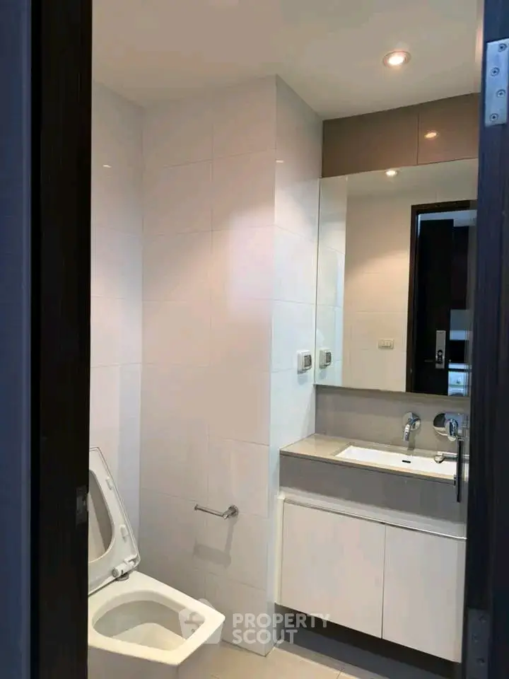 Modern bathroom with sleek fixtures and elegant design, perfect for contemporary living.