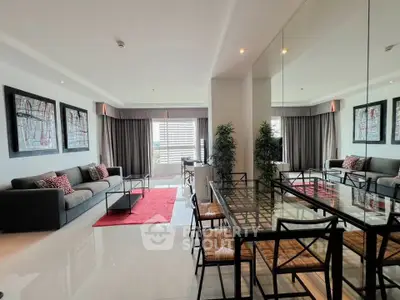 Spacious modern living room with elegant decor and large windows