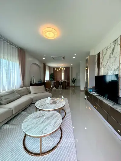 Luxurious modern living room with elegant marble tables and plush sofa
