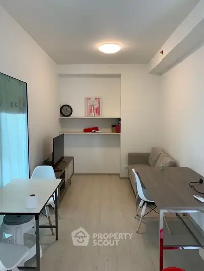 Modern living room with sleek furniture and minimalist decor, perfect for urban living.