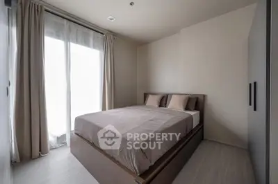 Modern minimalist bedroom with natural light and neutral tones