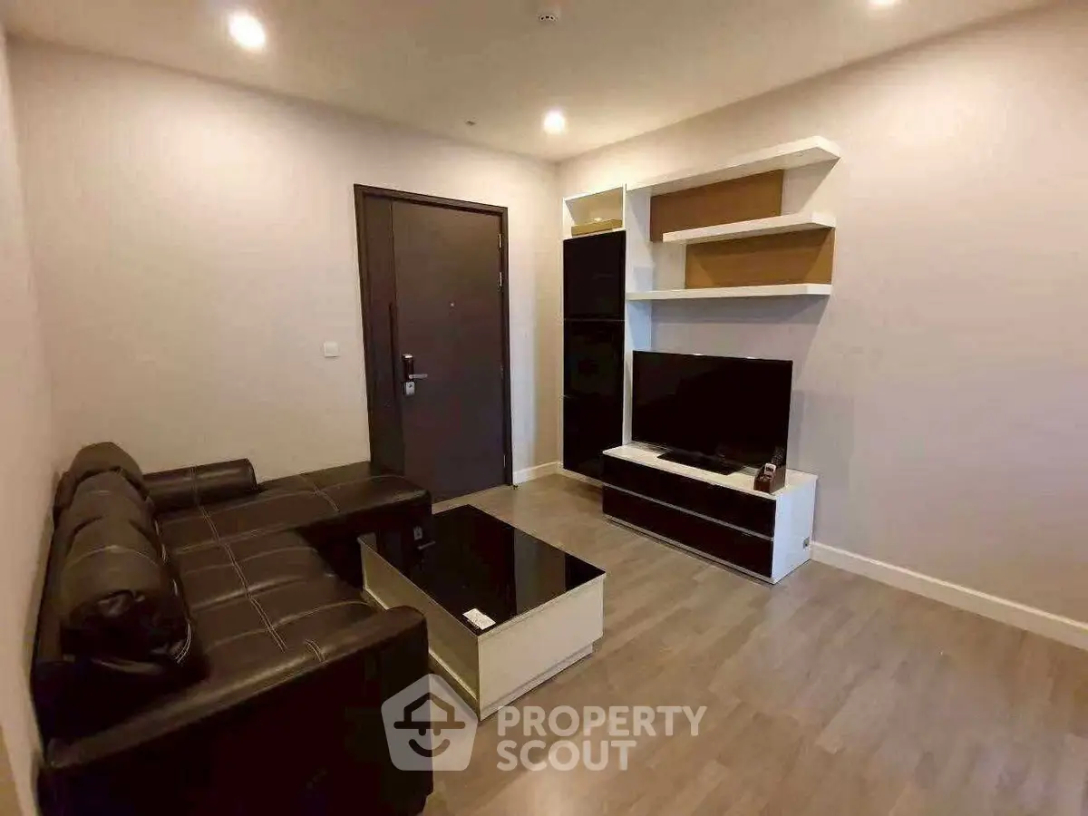 Modern living room with sleek furniture and stylish shelving