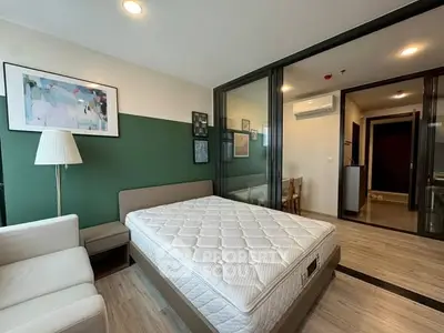 Modern bedroom with stylish decor and comfortable furnishings in a contemporary apartment.
