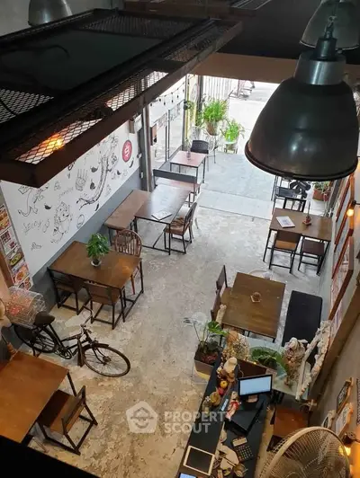 Chic industrial-style cafe with open layout and artistic decor
