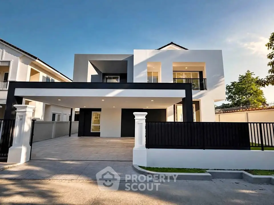 Modern two-story house with sleek design and spacious driveway in a serene neighborhood.