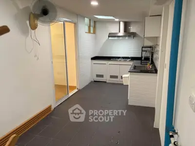 Modern kitchen with sleek black countertops and open layout design