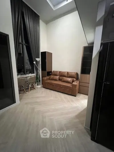 Modern living room with high ceiling and elegant decor