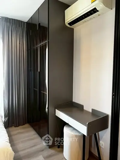 Modern bedroom with sleek wardrobe and compact study desk