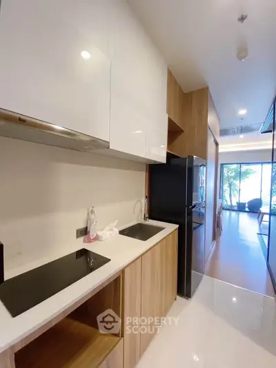 Modern kitchen with sleek design and open layout in a stylish apartment