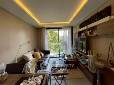 Modern living room with cozy seating and balcony view
