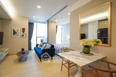 Modern open-plan living room with stylish decor and natural light