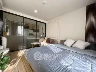 Modern bedroom with sliding glass doors and cozy decor